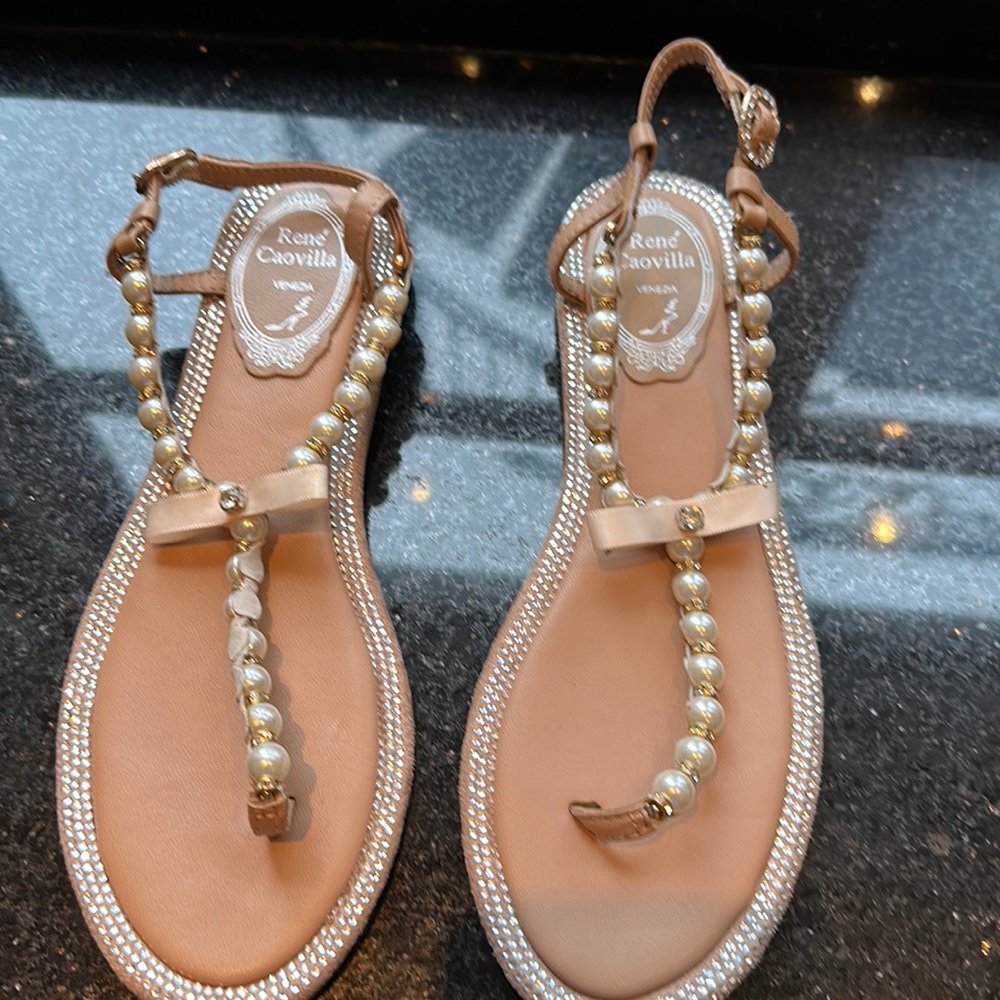 A pair of beige pearl and diamanté sandals